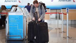 American Airlines raises bag fees, won't allow some travel agency bookings to earn miles