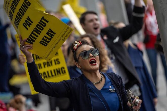 United Flight Attendants Picket For Improved Wages, Contract at Airports Across the Country As Executive Comp Skyrockets