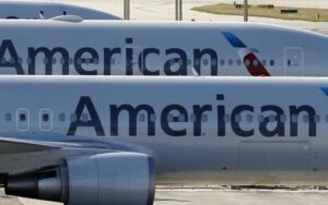 Why won't American Airlines refund my tickets after they dumped me into 'economy plus'?